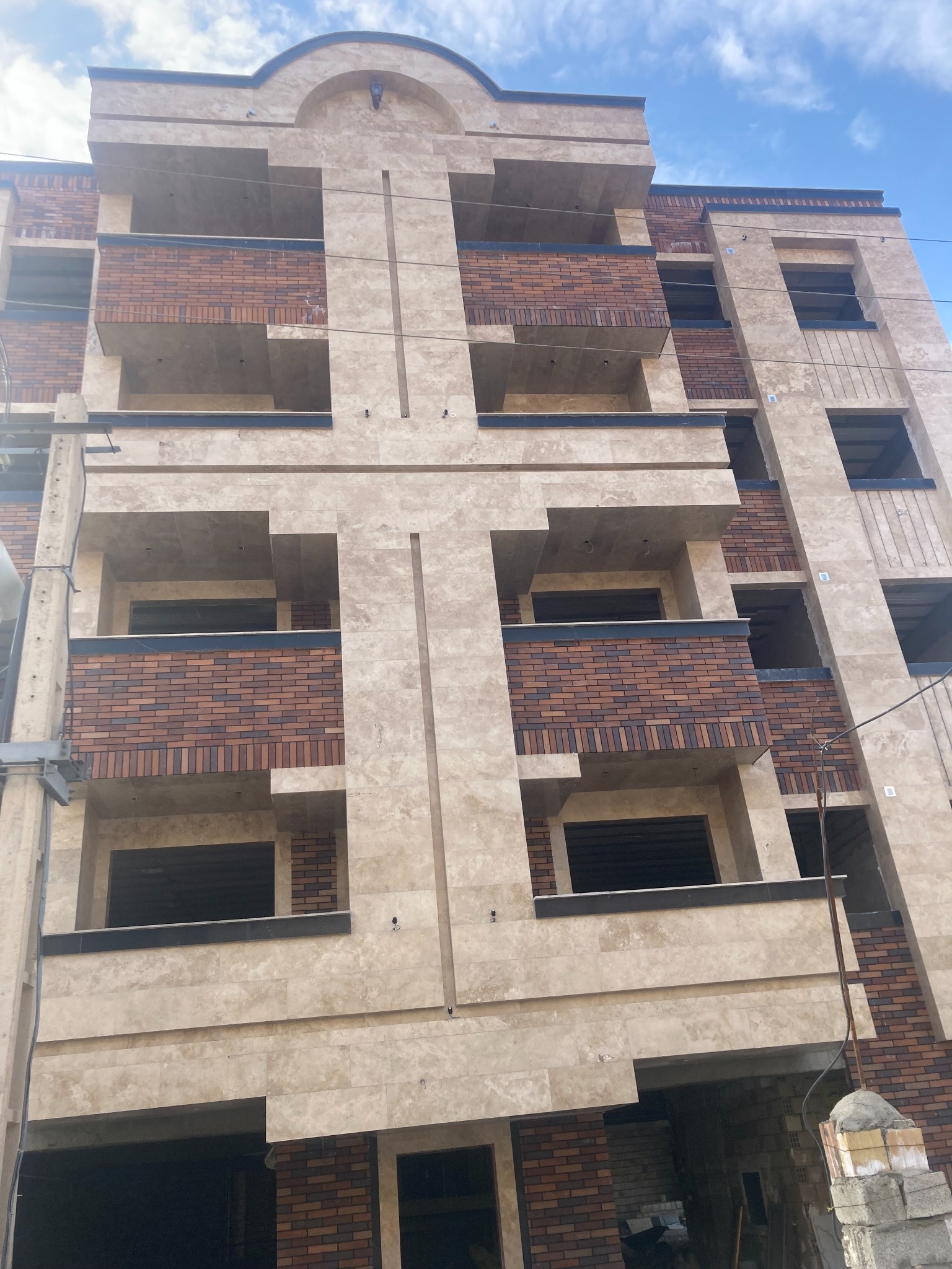 Mixed stone and brick apartment building
