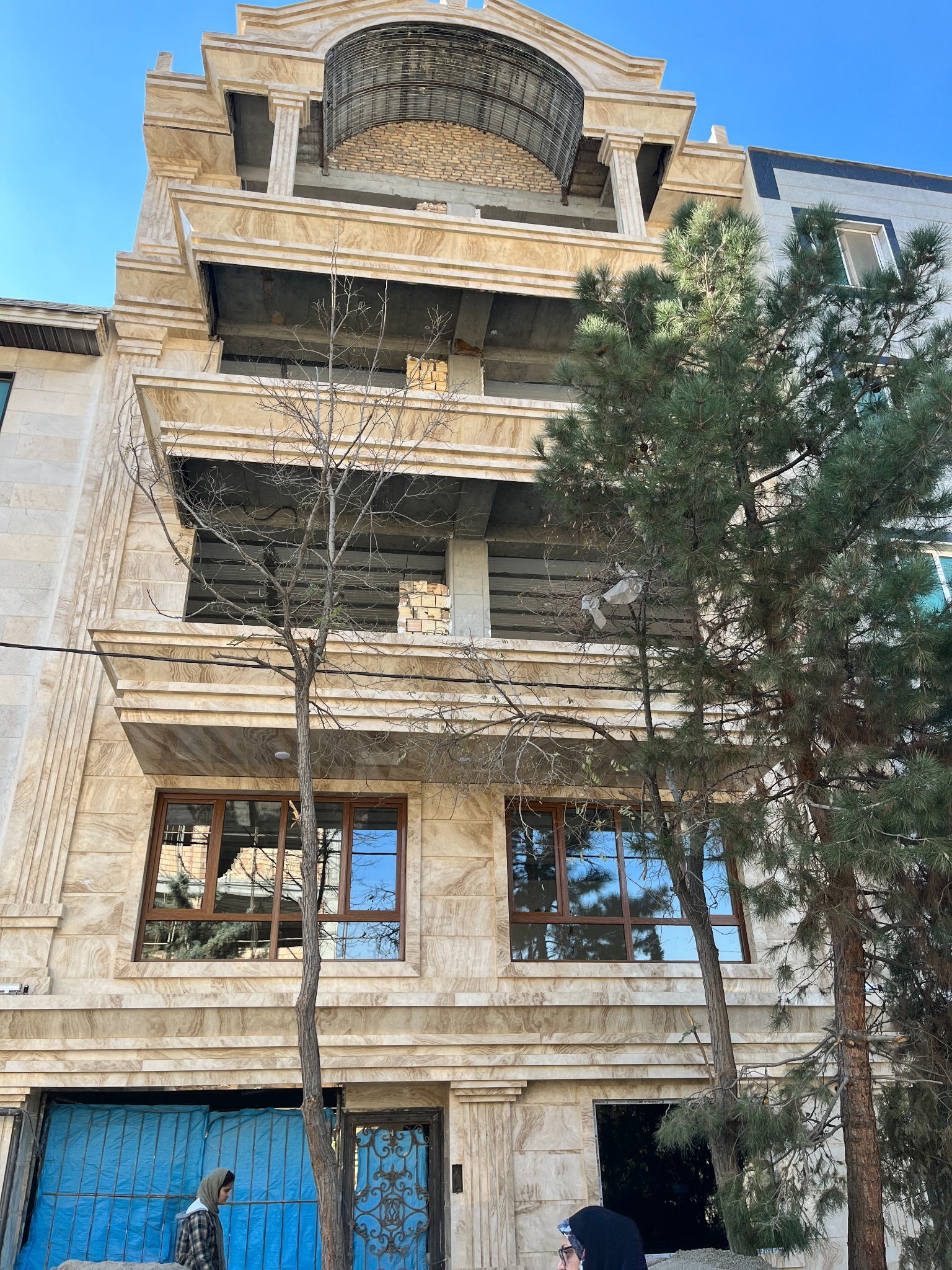 Stone residential façade under construction